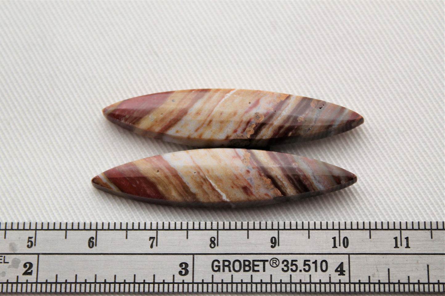 Marquise pair of Petrified Wood Cabochons red